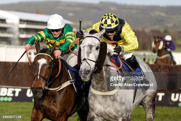 Freddie Gingell riding Elixir De Nutz clear the last to win The My Pension Expert Clarence House Chase from James Bowen riding Jonbon at Cheltenham...