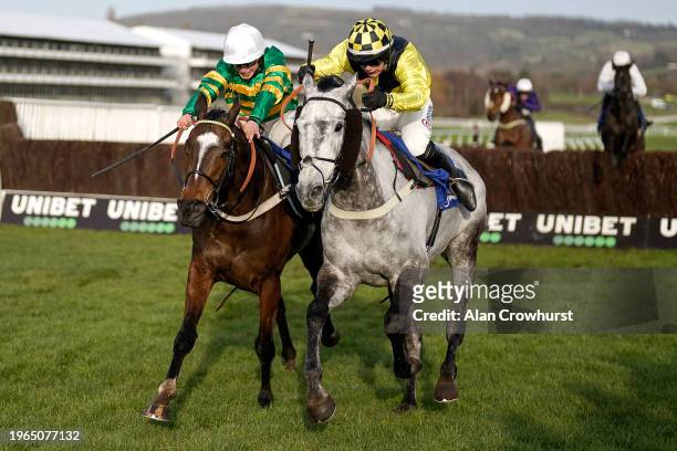 Freddie Gingell riding Elixir De Nutz clear the last to win The My Pension Expert Clarence House Chase from James Bowen riding Jonbon at Cheltenham...