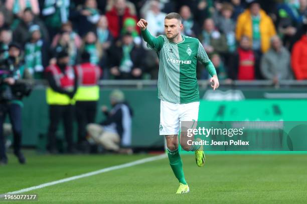 Marvin Ducksch of Werder Bremen celebrates after scoring their sides first goal from the penalty spot during the Bundesliga match between SV Werder...