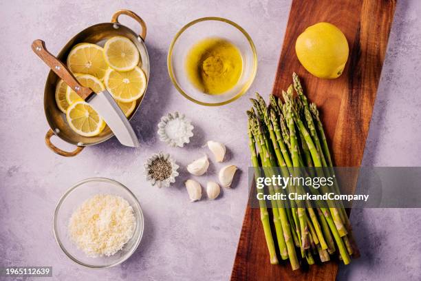 lemon roasted asparagus flat lay - lemon juice top view stock pictures, royalty-free photos & images