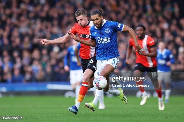 Dominic Calvert-Lewin of Everton holds off Reece Burke of Luton Town during the Emirates FA Cup Fourth Round match between Everton and Luton Town at...