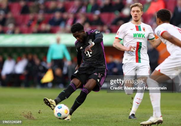 Alphonso Davies of Bayern Munich scores his team's second goal during the Bundesliga match between FC Augsburg and FC Bayern München at WWK-Arena on...