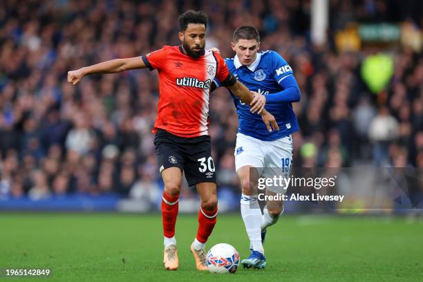 Andros Townsend of Luton Town holds off Vitaliy Mykolenko of Everton during the Emirates FA Cup Fourth Round match between Everton and Luton Town at...