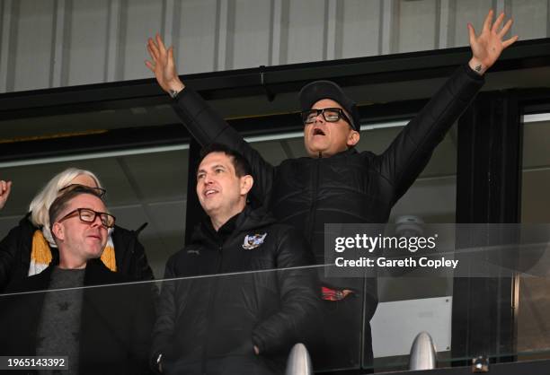 New Port Vale President and Pop Star Robbie Williams watches play during the Sky Bet League One match between Port Vale and Portsmouth at Vale Park...