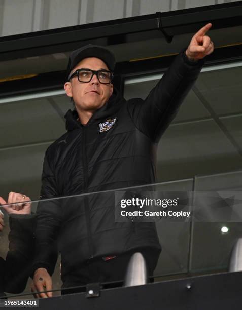 New Port Vale President and Pop Star Robbie Williams watches play during the Sky Bet League One match between Port Vale and Portsmouth at Vale Park...