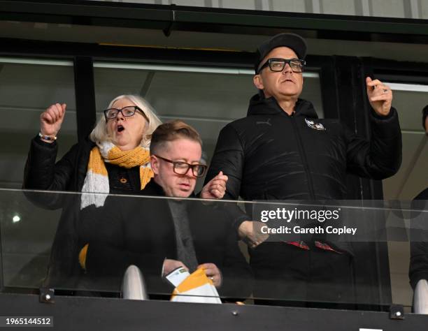 New Port Vale President and Pop Star Robbie Williams watches play with club owner Mrs Carol Shanahan during the Sky Bet League One match between Port...