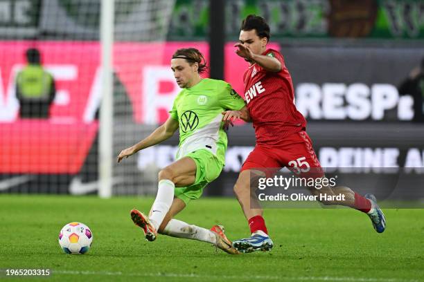 Lovro Majer of VfL Wolfsburg is challenged by Max Finkgrafe of 1.FC Köln during the Bundesliga match between VfL Wolfsburg and 1. FC Köln at...