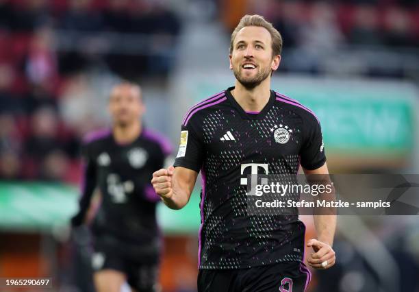 Harry Kane of Bayern Muenchen celebrates as he scores the goal 1:3 during the Bundesliga match between FC Augsburg and FC Bayern München at WWK-Arena...