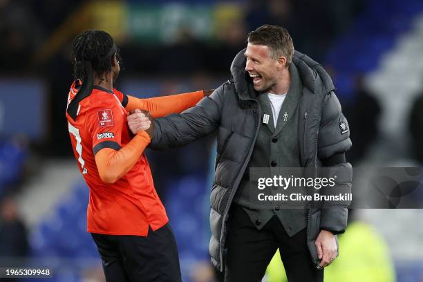 Pelly Ruddock Mpanzu of Luton Town celebrates with Rob Edwards, Manager of Luton Town, following their sides victory after the Emirates FA Cup Fourth...