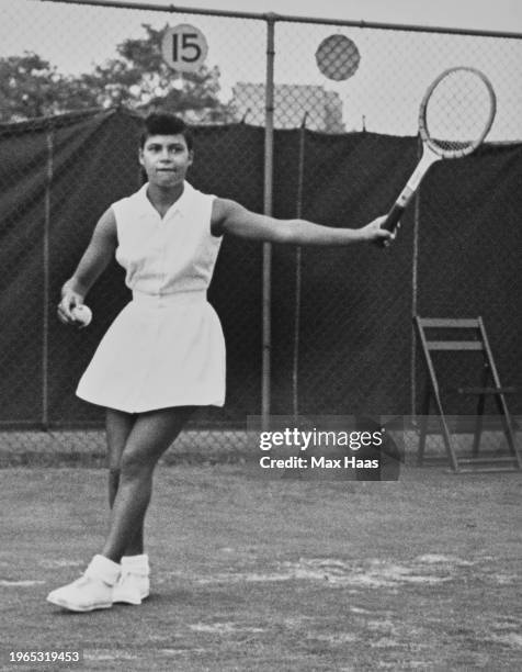 American tennis player Lorraine Williams a tennis ball in her right hand, and a tennis racket in her left, during the US National Championships, held...