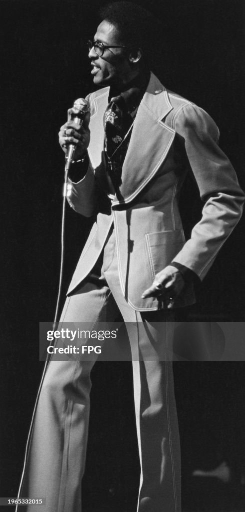 Amy David Ruffin American singer David Ruffin, a microphone in his right hand as he ...