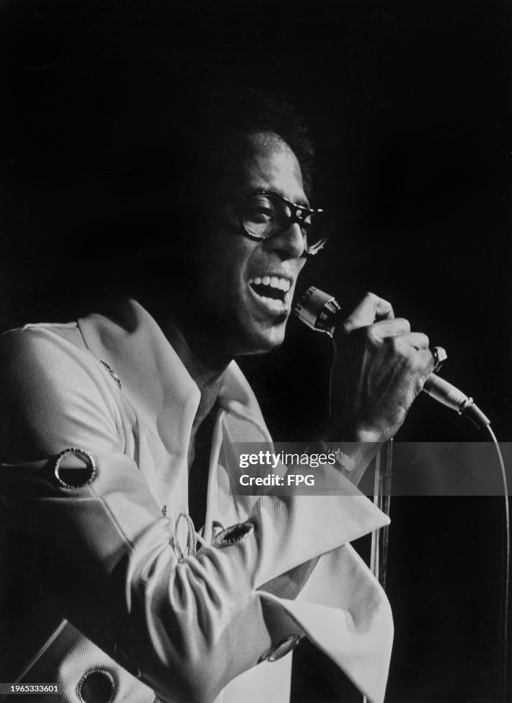 David Ruffin Headshot American singer David Ruffin, a microphone in his right hand as he ...