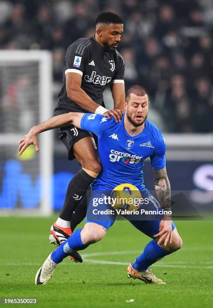 Alberto Cerri of Empoli FC is challenged by Bremer of Juventus during the Serie A TIM match between Juventus and Empoli FC - Serie A TIM at Allianz...