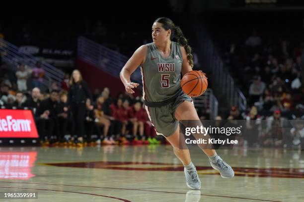 Washington State Cougars guard Charlisse Leger-Walker dribbles the ball against the Southern California Trojans in the second half of an NCAA college...