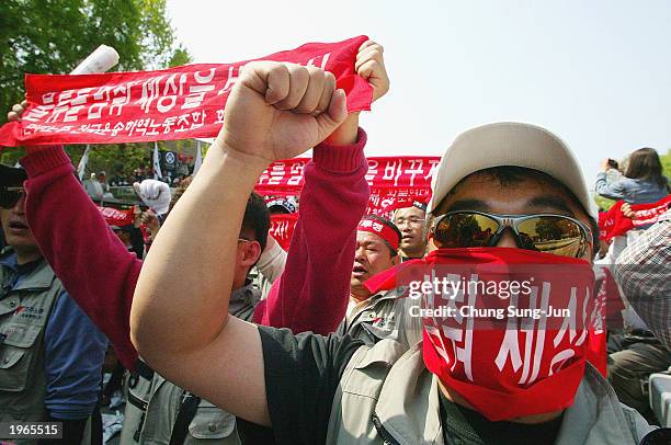 South Korean workers shout slogans during a May Day protest in Seoul, May 1 2003. Tens of thousands South Korean union members gathered across the...