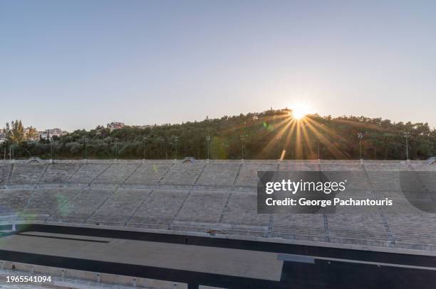 sunlight over the panathenaic stadium in athens, greece - 1896 summer olympics athens stock pictures, royalty-free photos & images