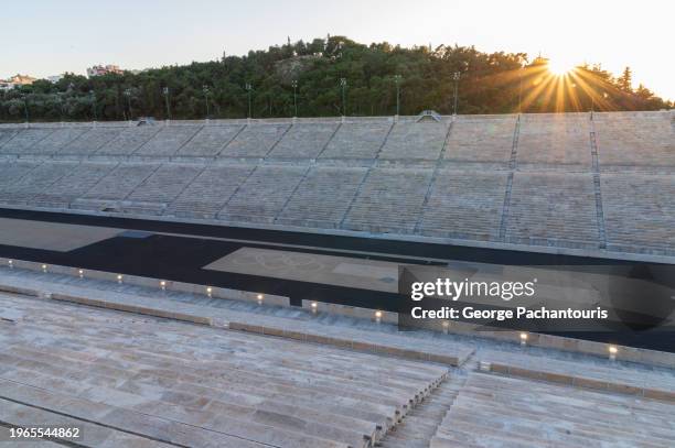 sunlight over the panathenaic stadium in athens, greece - antiche olimpiadi foto e immagini stock