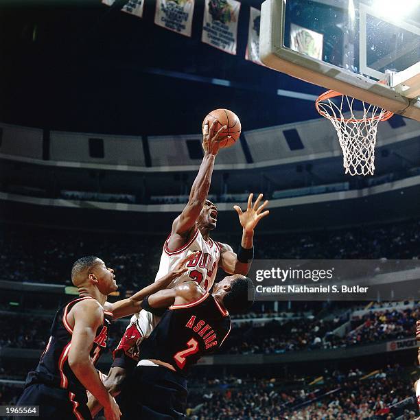 Michael Jordan of the Chicago Bulls drives to the hoop against the Miami Heat during an NBA game at the United Center on January 26, 1996 in Chicago,...