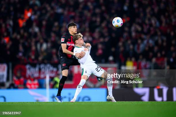 Piero Hincapie of Leverkusen challenges Robin Hack of Moenchengladbach during the Bundesliga match between Bayer 04 Leverkusen and Borussia...