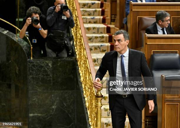 Spain's Prime Minister Pedro Sanchez leaves during a break of the plenary session before a vote on the government's controversial amnesty bill, at...