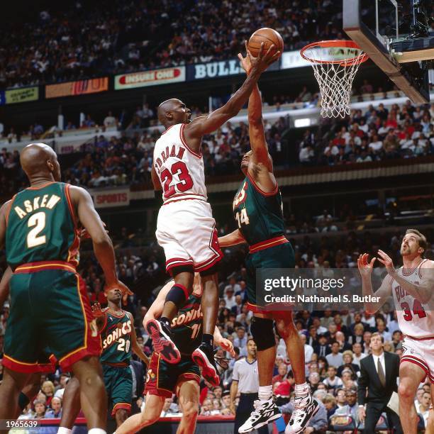 Michael Jordan of the Chicago Bulls drives to the basket against the Seattle SuperSonics during Game one of the 1996 NBA Finals at the United Center...