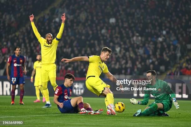 Alexander Sorloth of Villarreal CF scores his team's fourth goal during the LaLiga EA Sports match between FC Barcelona and Villarreal CF at Estadi...