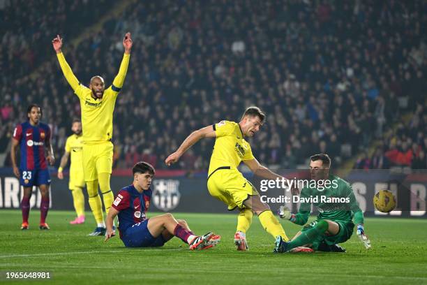 Alexander Sorloth of Villarreal CF scores his team's fourth goal during the LaLiga EA Sports match between FC Barcelona and Villarreal CF at Estadi...