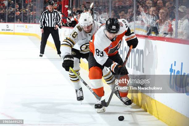 Pavel Zacha of the Boston Bruins and Cam Atkinson of the Philadelphia Flyers challenge for the puck during the second periodat the Wells Fargo Center...