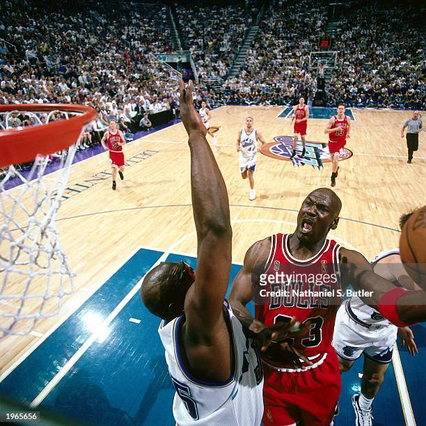 Michael Jordan of the Chicago Bulls attemps a layup against the Utah Jazz during Game five of the 1997 NBA Finals at the Delta Center on June 11,...