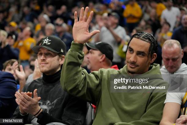 Jordan Love of the Green Bay Packers waves to the crowd in the second half of the game between the Seton Hall Pirates and Marquette Golden Eagles at...