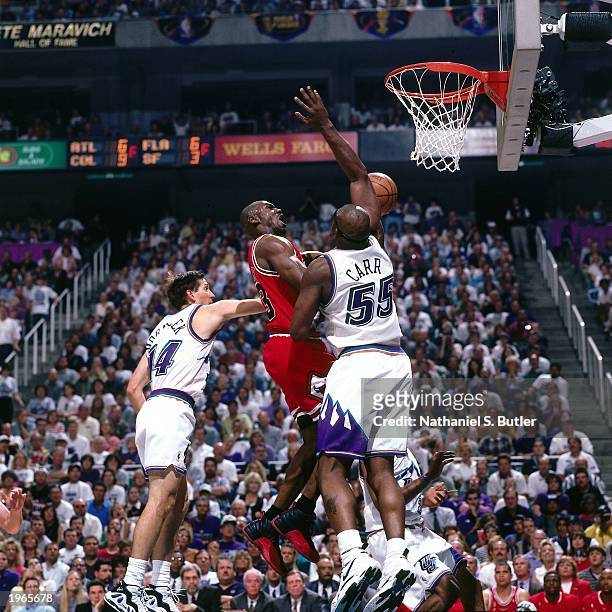 Michael Jordan of the Chicago Bulls drives down the lane against the Utah Jazz during Game five of the 1997 NBA Finals at the Delta Center on June...