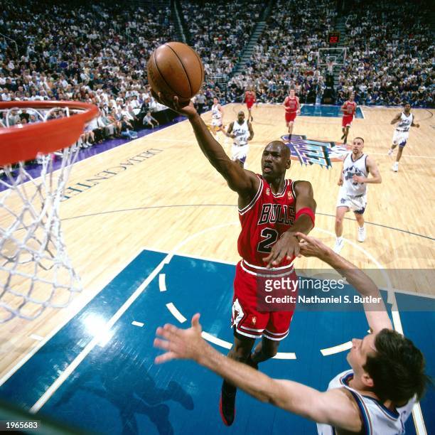 Michael Jordan of the Chicago Bulls attempts a layup against the Utah Jazz during Game five of the 1997 NBA Finals at the Delta Center on June 11,...