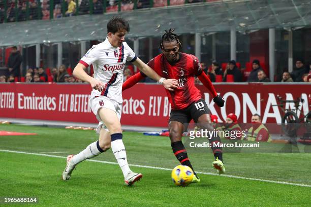 Rafael Leao of AC Milan and Giovanni Fabbian of Bologna FC battle for the ball during the Serie A TIM match between AC Milan and Bologna FC - Serie A...