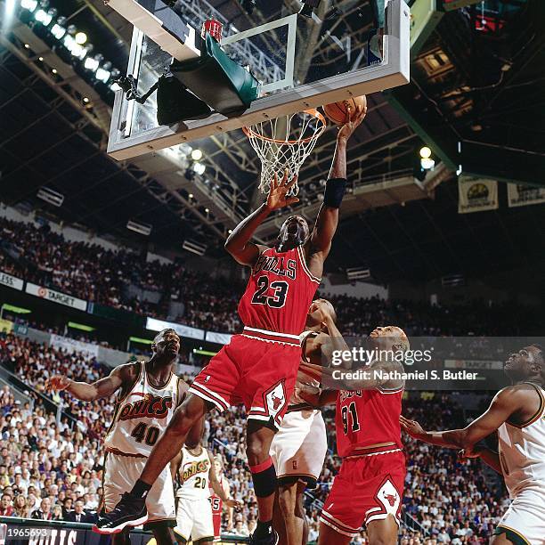 Michael Jordan of the Chicago Bulls drives to the basket against the Seattle SuperSonics during Game five of the 1996 NBA Finals at the KeyArena on...