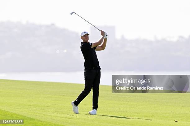 Ludvig Aberg of Sweden plays his shot on the fourth hole during the final round of the Farmers Insurance Open at Torrey Pines South Course on January...