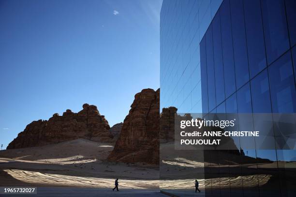 Man walks in front of the Maraya , the world's largest mirrored building, in the desert canyon of Ashar Valley in Saudi Arabia's northwestern Al-Ula...