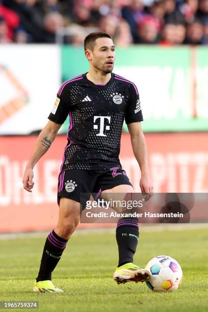 Raphael Guerreiro of FC Bayern München runs with the ball during the Bundesliga match between FC Augsburg and FC Bayern München at WWK-Arena on...