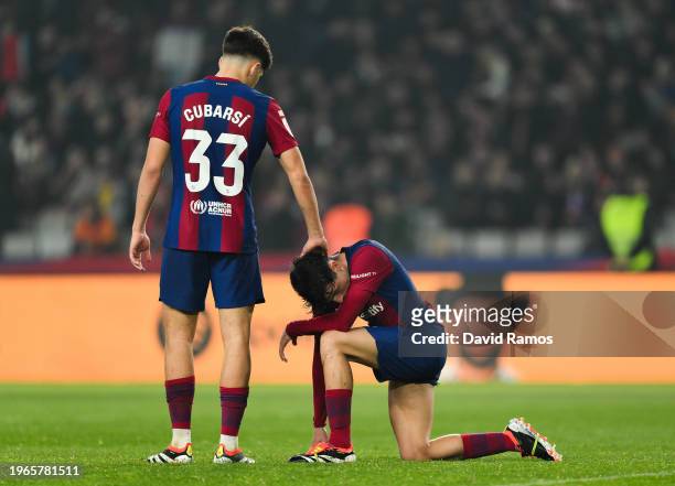 Pau Cubarsi and Pedri of FC Barcelona looks dejected at full-time following the teams defeat in the LaLiga EA Sports match between FC Barcelona and...