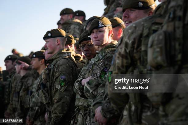 Soldiers from the 2nd Battalion The Royal Anglian Regiment, also known as 'The Poachers', gather for a group photo during a media visit to Kendrew...