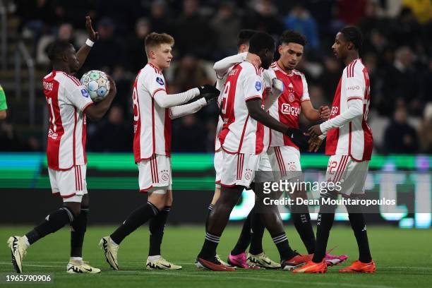 Brian Brobbey of Ajax celebrates with teammates after scoring his team's first goal during the Dutch Eredivisie match between Heracles Almelo and AFC...