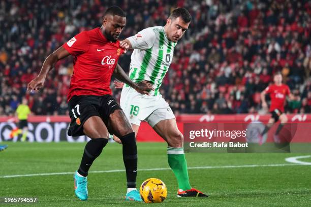 Cyle Larin of RCD Mallorca and Sokratis Papastathopoulos of Real Betis competes for the ball during the LaLiga EA Sports match between RCD Mallorca...