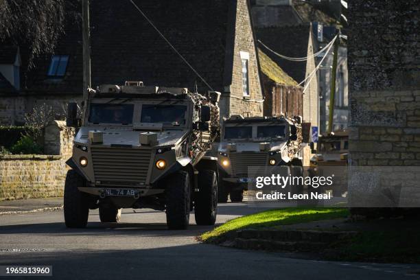 Column of Foxhound Light Protected Patrol Vehicle passes through the village of Market Overton on January 26, 2024 near Oakham, England. As part of...