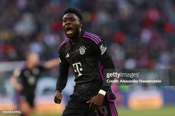 Alphonso Davies of Bayern Munich celebrates scoring his team's second goal during the Bundesliga match between FC Augsburg and FC Bayern München at...
