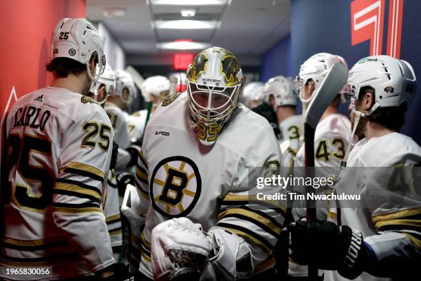 Linus Ullmark of the Boston Bruins greets teammates before playing against the Philadelphia Flyers at the Wells Fargo Center on January 27, 2024 in...