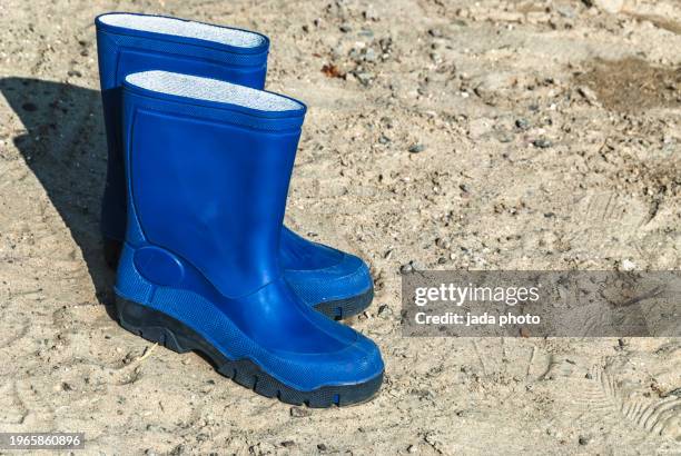 two blue rubber boots - blue boot stock pictures, royalty-free photos & images