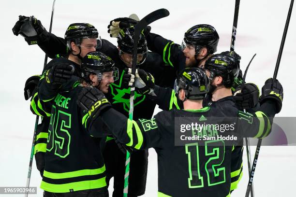 The Dallas Stars celebrate after teammate Thomas Harley scored the game-winning goal in overtime to defeat the Washington Capitals at American...