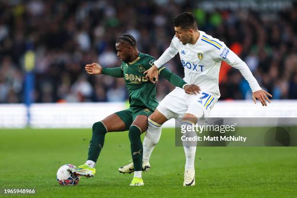 Bali Mumba of Plymouth Argyle battles for possession with Joel Piroe of Leeds United during the Emirates FA Cup Fourth Round match between Leeds...