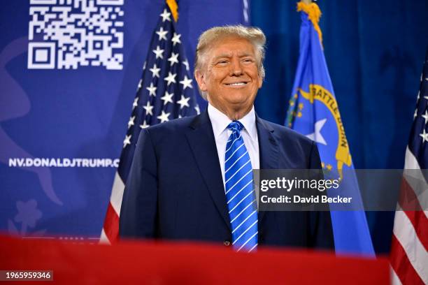 Republican presidential candidate and former U.S. President Donald Trump stands on stage during a campaign event at Big League Dreams Las Vegas on...