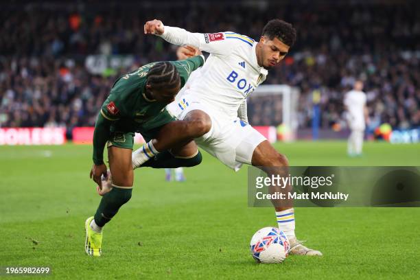 Georginio Rutter of Leeds United battles for possession with Bali Mumba of Plymouth Argyle during the Emirates FA Cup Fourth Round match between...