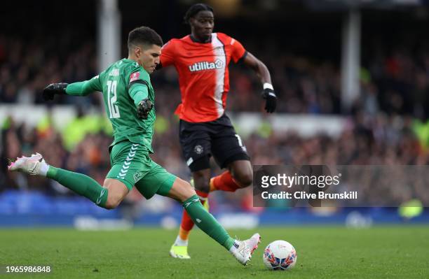 Joao Virginia of Everton attempts to clear the ball from Elijah Adebayo of Luton Town during the Emirates FA Cup Fourth Round match between Liverpool...